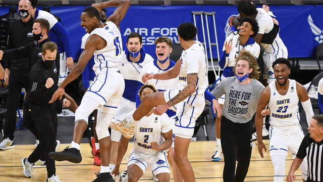 LAS VEGAS, NEVADA - MARCH 13: UC Santa Barbara players celebrate their 79-63 victory over the UC Irvine Anteaters in the championship game of the Big West Basketball tournament at Michelob ULTRA Arena on March 13, 2021 in Las Vegas, Nevada.