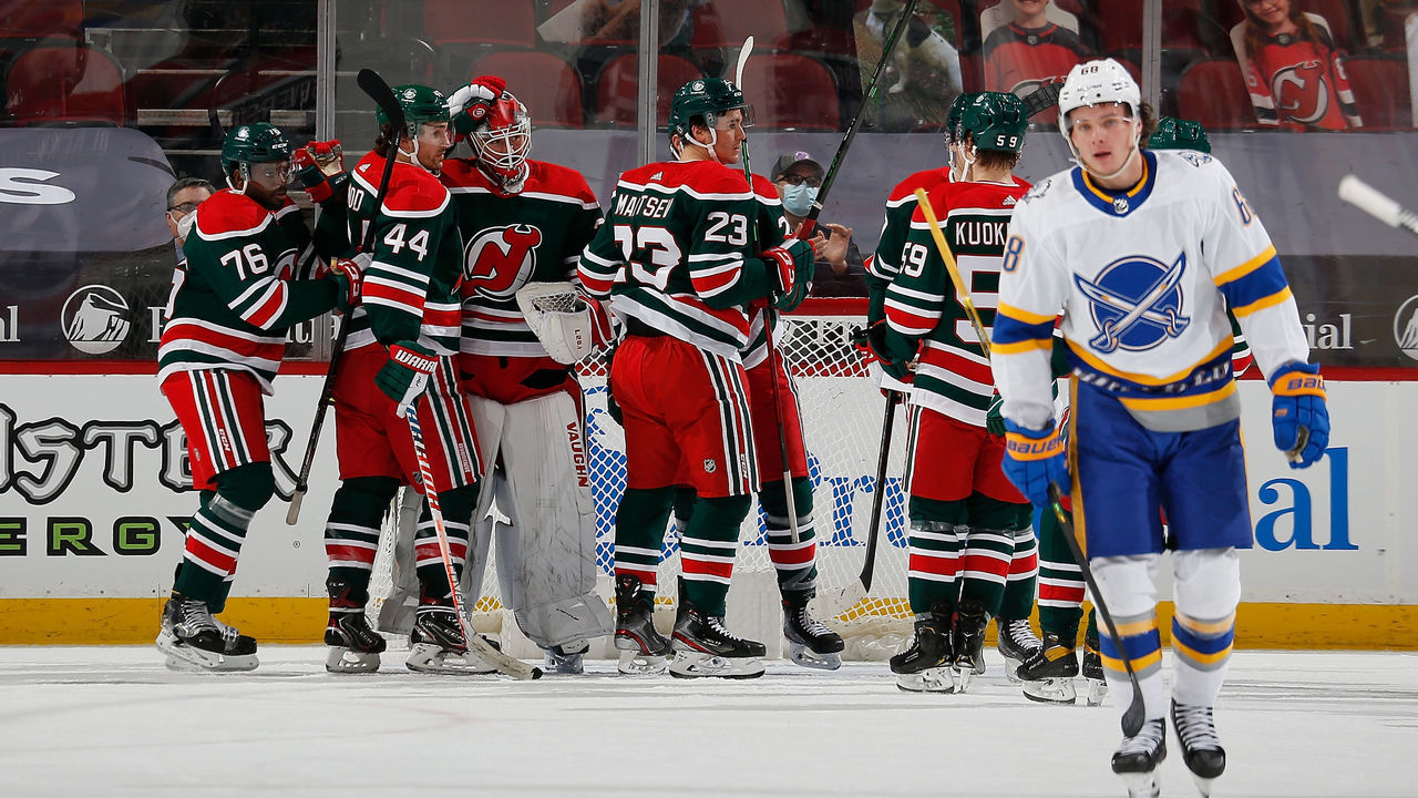 NEWARK, NEW JERSEY - MARCH 16: Mackenzie Blackwood #29 and Miles Wood #44 of the New Jersey Devils celebrate their 3-2 win over the Buffalo Sabres at Prudential Center on March 16, 2021 in Newark, New Jersey.