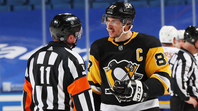 BUFFALO, NY - MARCH 11: Sidney Crosby #87 of the Pittsburgh Penguins speaks with referee Kelly Sutherland #11 during an NHL game against the Buffalo Sabres on March 11, 2021 at KeyBank Center in Buffalo, New York.