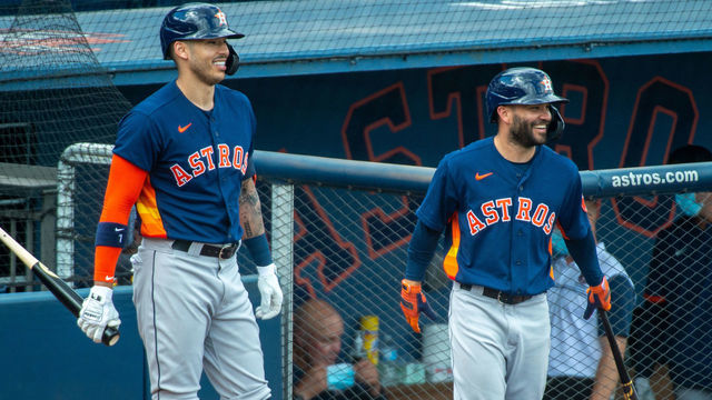 WEST PALM BEACH, FL - MARCH 01: Carlos Correa #1 and Jose Altuve #27 of the Houston Astros wait on deck before the start of the Spring Training game against the Washington Nationals at FITTEAM Ballpark on March 1, 2021 in West Palm Beach, Florida.