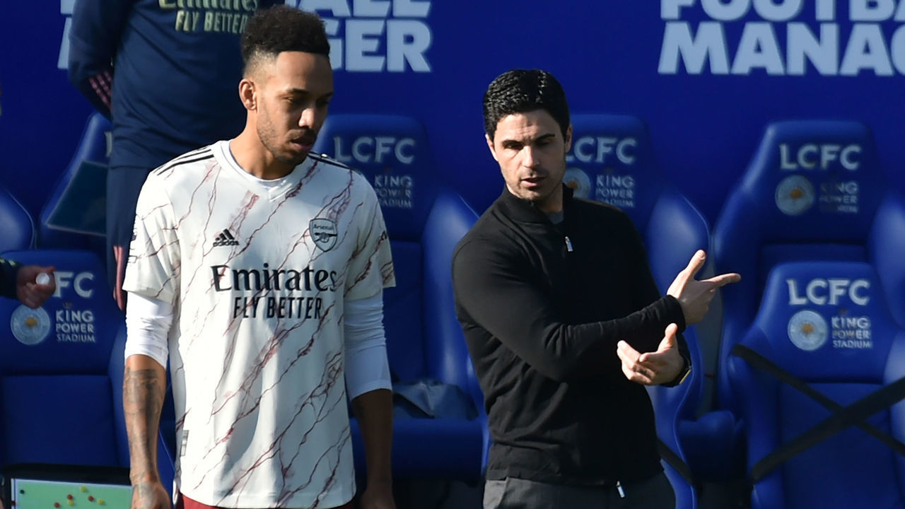 Arsenal's Spanish manager Mikel Arteta (R) speaks with Arsenal's Gabonese striker Pierre-Emerick Aubameyang (L) as he comes on as a late substitute during the English Premier League football match between Leicester City and Arsenal at King Power Stadium in Leicester, central England on February 28, 2021.