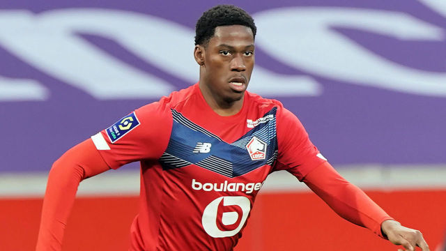 LILLE, FRANCE - FEBRUARY 28: Jonathan David of Lille OSC runs with the ball during the Ligue 1 match between Lille OSC and RC Strasbourg at Stade Pierre Mauroy on February 28, 2021 in Lille, France.
