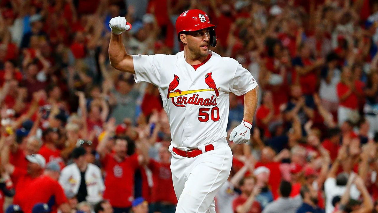 ST LOUIS, MO - SEPTEMBER 13: Adam Wainwright #50 of the St. Louis Cardinals celebrates after Paul Goldschmidt #46 of the St. Louis Cardinals (not pictured) hit a grand slam against the Milwaukee Brewers in the third inning at Busch Stadium on September 13, 2019 in St Louis, Missouri.