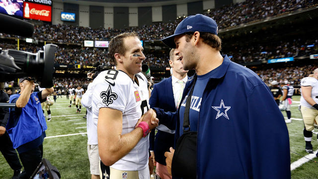 04 October 2015: New Orleans Saints Quarterback Drew Brees (9) talks with Dallas Cowboys Quarterback Tony Romo (9) after a game at the Mercedes-Benz Superdome in New Orleans, LA.