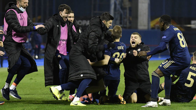 ZAGREB, CROATIA - MARCH 18: Mislav Orsic of GNK Dinamo Zagreb celebrates with team mates after scoring their side's third goal and his hat-trick during the UEFA Europa League Round of 16 Second Leg match between Dinamo Zagreb and Tottenham Hotspur at Stadion Maksimir on March 18, 2021 in Zagreb, Croatia. Sporting stadiums around Europe remain under strict restrictions due to the Coronavirus Pandemic as Government social distancing laws prohibit fans inside venues resulting in games being played behind closed doors.