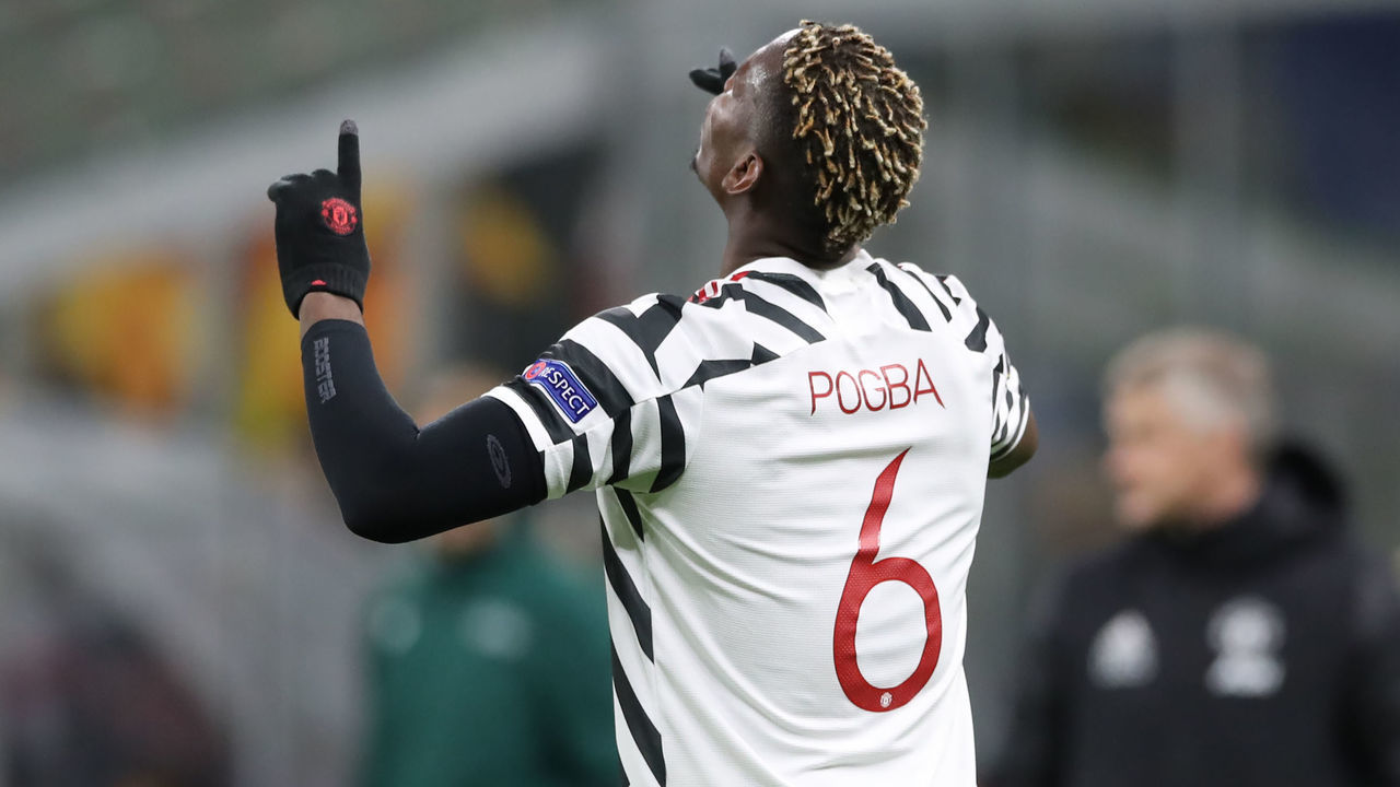 MILAN, ITALY - MARCH 18: Paul Pogba of Manchester United celebrates after scoring to give the side a 1-0 lead during the UEFA Europa League Round of 16 Second Leg match between AC Milan and Manchester United at San Siro on March 18, 2021 in Milan, Italy. Sporting stadiums around Europe remain under strict restrictions due to the Coronavirus Pandemic as Government social distancing laws prohibit fans inside venues resulting in games being played behind closed doors.