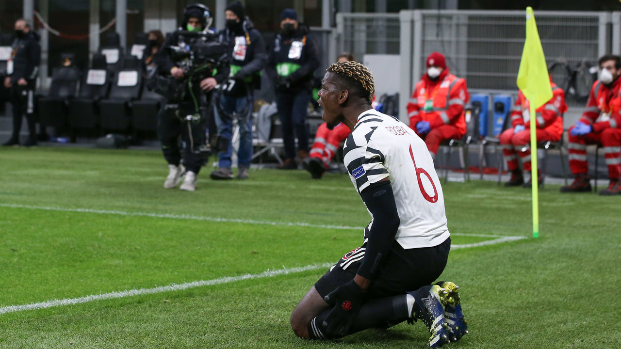 MILAN, ITALY - MARCH 18: Paul Pogba of Manchester United reacts after being bundled out of play by an opponent during the UEFA Europa League Round of 16 Second Leg match between AC Milan and Manchester United at San Siro on March 18, 2021 in Milan, Italy. Sporting stadiums around Europe remain under strict restrictions due to the Coronavirus Pandemic as Government social distancing laws prohibit fans inside venues resulting in games being played behind closed doors.