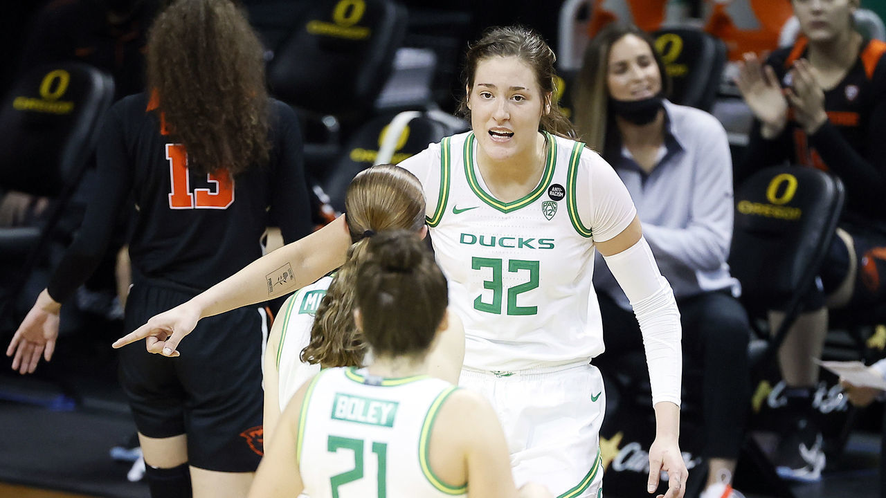 EUGENE, OREGON - FEBRUARY 28: Sedona Prince #32 of the Oregon Ducks gestures while talking with her teammates during the first half against the Oregon State Beavers at Matthew Knight Arena on February 28, 2021 in Eugene, Oregon.