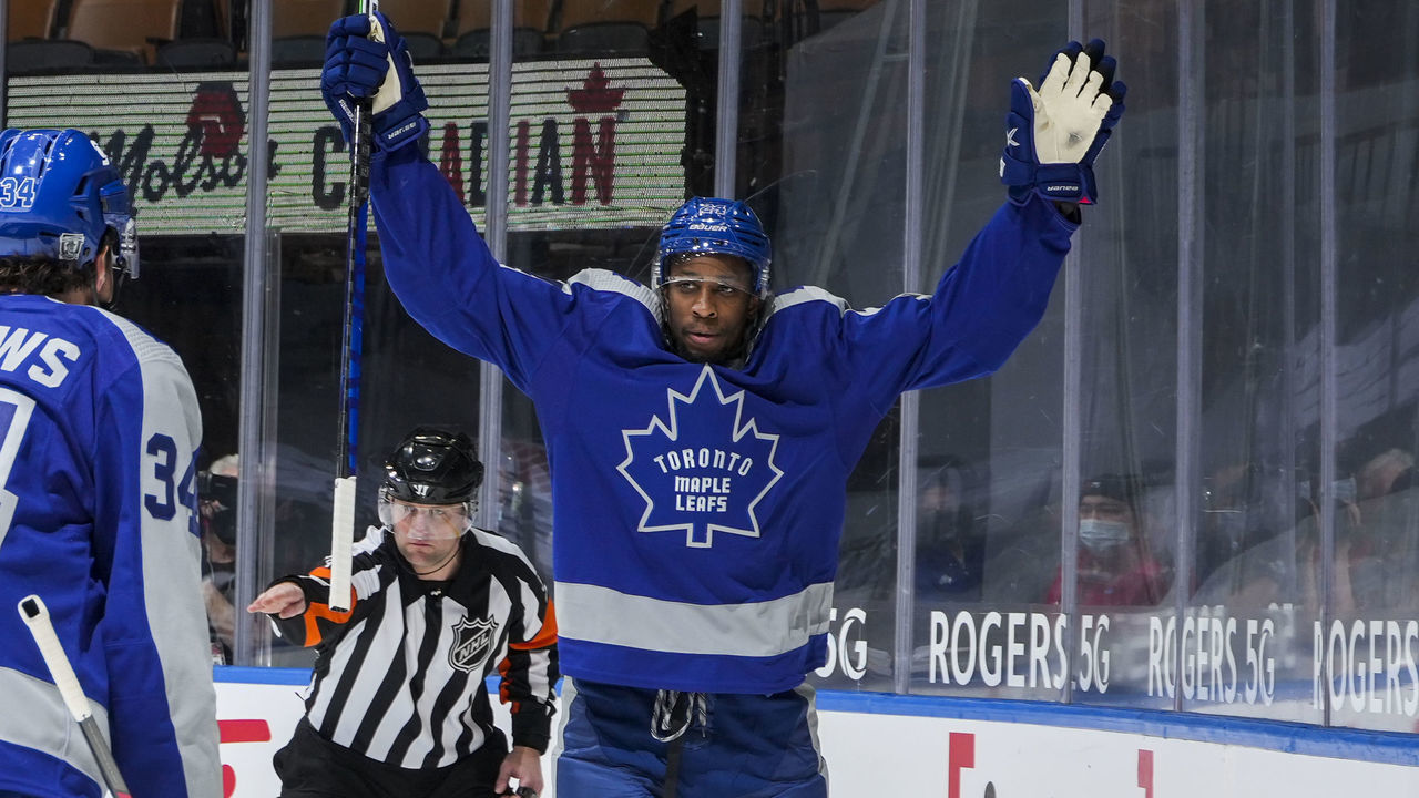 TORONTO, ON - FEBRUARY 6: Wayne Simmonds #24 of the Toronto Maple Leafs celebrates his goal against Braden Holtby #49 of the Vancouver Canucks with teammate Auston Matthews #34 during the first period at the Scotiabank Arena on February 6, 2021 in Toronto, Ontario, Canada.