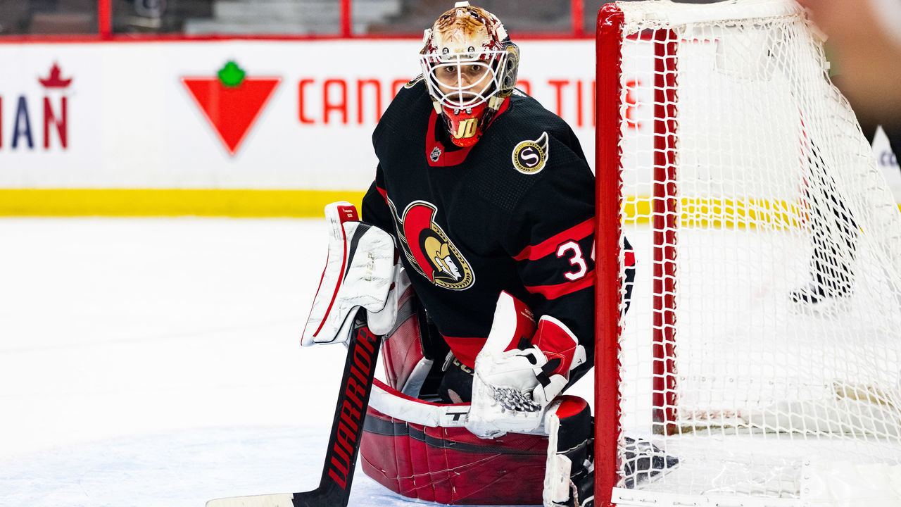 OTTAWA, ON - MARCH 17: Ottawa Senators Goalie Joey Daccord (34) tracks the play to the corner during first period National Hockey League action between the Vancouver Canucks and Ottawa Senators on March 17, 2021, at Canadian Tire Centre in Ottawa, ON, Canada.