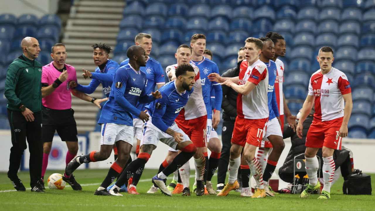 GLASGOW, SCOTLAND - MARCH 18: Rangers' Connor Goldson (right) and Glen Kamara take exception to something said by Slavia's Ondre Kudela during the UEFA Europa League Round of 16 2nd Leg match between Rangers FC and Slavia Prague at Ibrox Stadium on March 18, 2021, in Glasgow, Scotland.