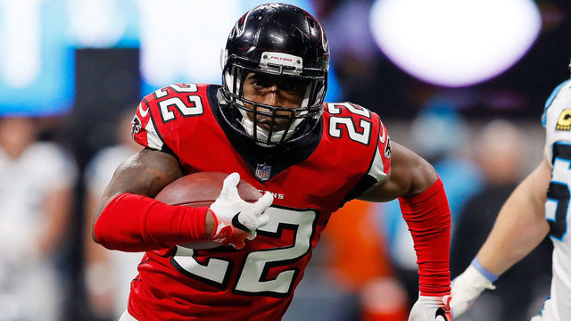 ATLANTA, GA - DECEMBER 31: Keanu Neal #22 of the Atlanta Falcons returns an interception during the second half against the Carolina Panthers at Mercedes-Benz Stadium on December 31, 2017 in Atlanta, Georgia.