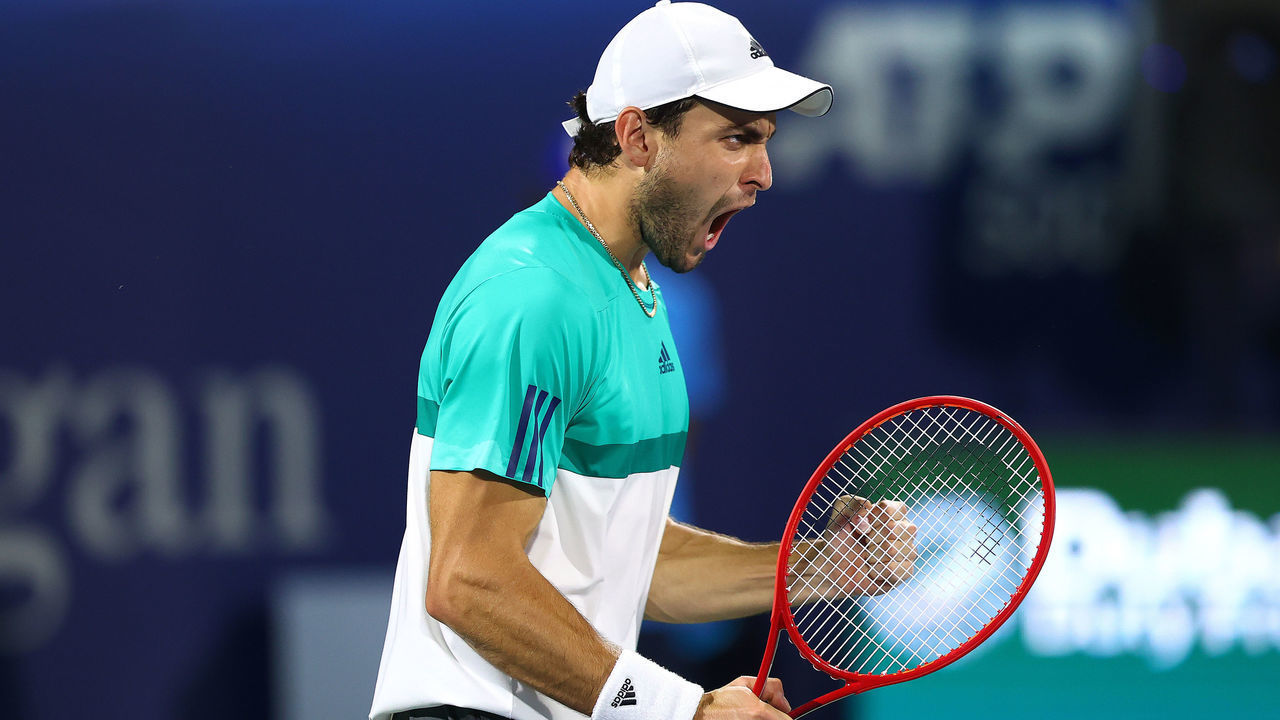 DUBAI, UNITED ARAB EMIRATES - MARCH 20: Aslan Karatsev of Russia celebrates beating Lloyd Harris of South Africa to win the men's singles Final match on day fourteen of the Dubai Duty Free Tennis at Dubai Duty Free Tennis Stadium on March 20, 2021 in Dubai, United Arab Emirates.