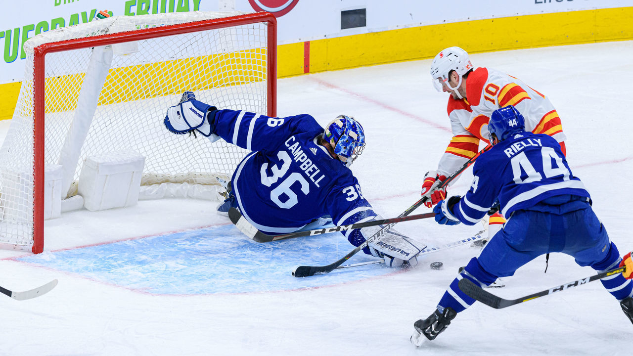 TORONTO, ON - MARCH 20: Toronto Maple Leafs Goalie Jack Campbell (36) makes a save on Calgary Flames Center Derek Ryan (10) during the NHL regular season game between the Calgary Flames and the Toronto Maple Leafs on March 20, 2021, at Scotiabank Arena in Toronto, ON, Canada.