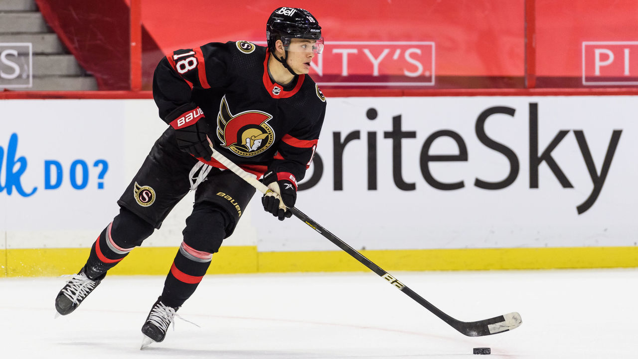 OTTAWA, ON - FEBRUARY 25: Ottawa Senators Left Wing Tim Stutzle (18) controls the puck during the first period of the NHL game between the Ottawa Senators and the Calgary Flames on February 25, 2021 at the Canadian Tire Centre in Ottawa, Ontario, Canada.