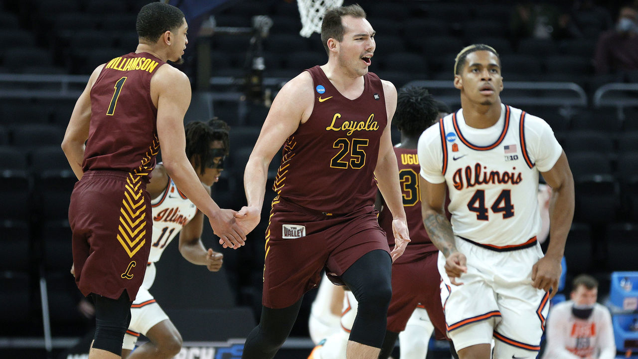 INDIANAPOLIS, INDIANA - MARCH 21: Cameron Krutwig #25 of the Loyola Chicago Ramblers celebrates a basket against the Illinois Fighting Illini during the first half in the second round game of the 2021 NCAA Men's Basketball Tournament at Bankers Life Fieldhouse on March 21, 2021 in Indianapolis, Indiana.