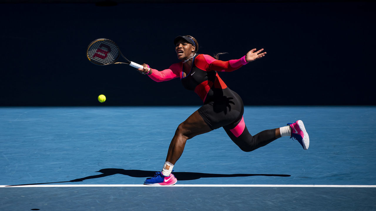 MELBOURNE, AUSTRALIA - FEBRUARY 18: Serena Williams of the United States hits a forehand against Naomi Osaka of Japan in the women's singles semi-finals during day 11 of the 2021 Australian Open at Melbourne Park on February 18, 2021 in Melbourne, Australia.