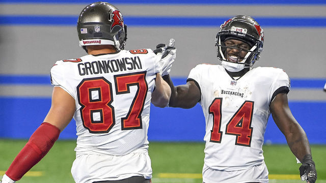 DETROIT, MICHIGAN - DECEMBER 26: Rob Gronkowski #87 of the Tampa Bay Buccaneers celebrates a 25 yard reception for a touchdown with Chris Godwin #14 of the Tampa Bay Buccaneers during the third quarter of a game against the Detroit Lions at Ford Field on December 26, 2020 in Detroit, Michigan. "n