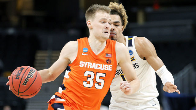 INDIANAPOLIS, INDIANA - MARCH 21: Buddy Boeheim #35 of the Syracuse Orange drives with the ball against Emmitt Matthews Jr. #11 of the West Virginia Mountaineers in the second half of their second round game of the 2021 NCAA Men's Basketball Tournament at Bankers Life Fieldhouse on March 21, 2021 in Indianapolis, Indiana.