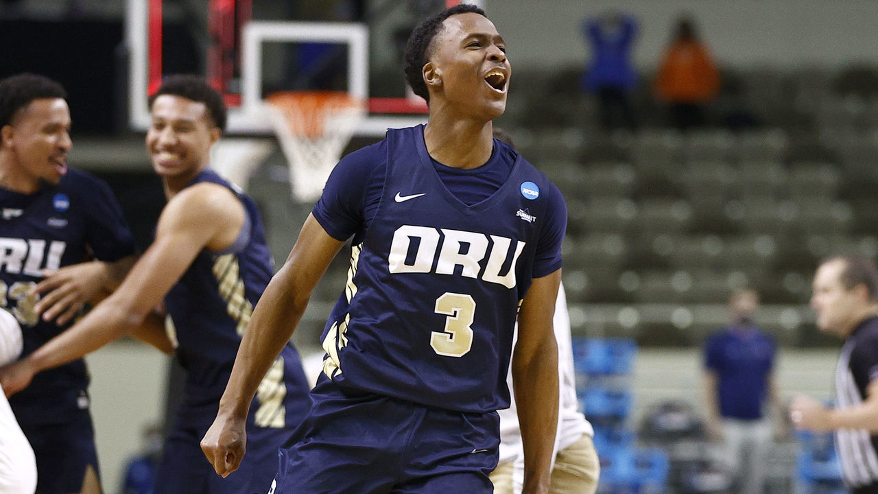 INDIANAPOLIS, INDIANA - MARCH 21: Max Abmas #3 of the Oral Roberts Golden Eagles celebrates with teammates after defeating the Florida Gators in the second round game of the 2021 NCAA Men's Basketball Tournament at Indiana Farmers Coliseum on March 21, 2021 in Indianapolis, Indiana. Oral Roberts defeated Florida 81-78.