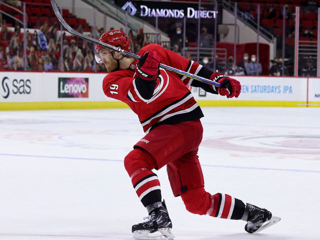 RALEIGH, NC - MARCH 20: Dougie Hamilton #19 of the Carolina Hurricanes shoots the puck during an NHL game against the Columbus Blue Jackets on March 20, 2021 at PNC Arena in Raleigh, North Carolina.