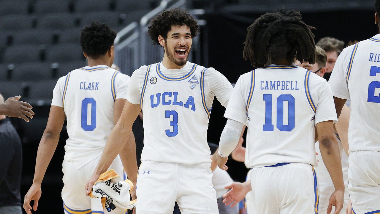 INDIANAPOLIS, INDIANA - MARCH 22: Johnny Juzang #3 of the UCLA Bruins reacts with teammates during the game against the Abilene Christian Wildcats in the second round of the 2021 NCAA Men's Basketball Tournament at Bankers Life Fieldhouse on March 22, 2021 in Indianapolis, Indiana.