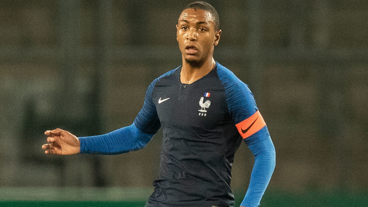 ESSEN, GERMANY - MARCH 21: Abdou Diallo of France runs with the ball during the International Friendly match between Germany U21 and France U21 at Stadion Essen) on March 21, 2019 in Essen, Germany.