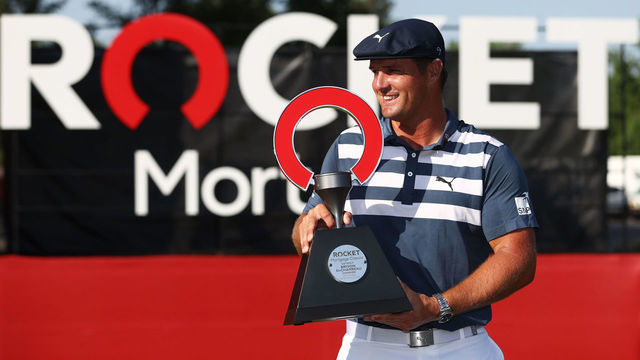 DETROIT, MICHIGAN - JULY 05: Bryson DeChambeau of the United States celebrates with the trophy after winning during the final round of the Rocket Mortgage Classic on July 05, 2020 at the Detroit Golf Club in Detroit, Michigan.