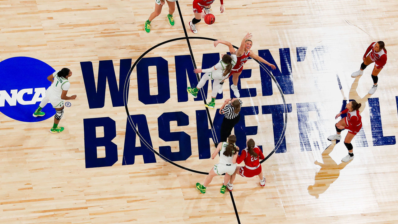SAN ANTONIO, TEXAS - MARCH 22: Sedona Prince #32 of the Oregon Ducks and Macy Guebert #3 of the South Dakota Coyotes tip off in the first round game of the 2021 NCAA Women's Basketball Tournament at the Alamodome on March 22, 2021 in San Antonio, Texas.