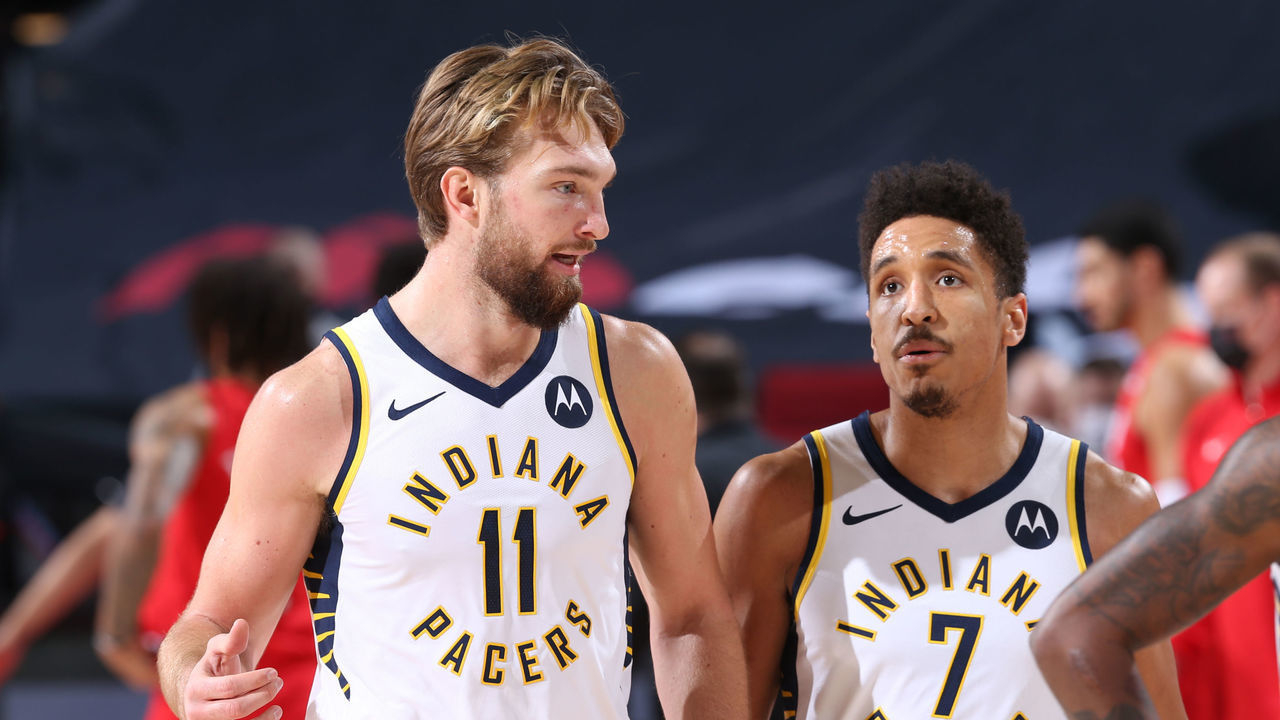 PORTLAND, OR - JANUARY 14: Domantas Sabonis #11 and Malcolm Brogdon #7 of the Indiana Pacers talk during the game against the Portland Trail Blazers on January 14, 2021 at the Moda Center Arena in Portland, Oregon. Mandatory Copyright Notice: Copyright 2021 NBAE