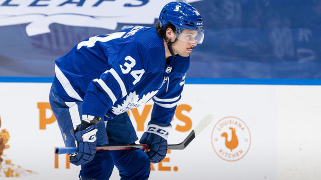TORONTO, ON - MARCH 20: Auston Matthews #34 of the Toronto Maple Leafs gets ready for a face-off against the Calgary Flames during the first period at the Scotiabank Arena on March 20, 2021 in Toronto, Ontario, Canada.