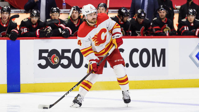 OTTAWA, ON - MARCH 22: Calgary Flames Defenceman Rasmus Andersson (4) controls the puck during the first period of the NHL game between the Ottawa Senators and the Calgary Flames on March 22, 2021 at the Canadian Tire Centre in Ottawa, Ontario, Canada.