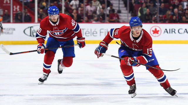 MONTREAL, QC - SEPTEMBER 22: Montreal Canadiens center Jesperi Kotkaniemi (15) and Montreal Canadiens right wing Joel Armia (40) skate towards the puck during the Ottawa Senators versus the Montreal Canadiens preseason game on September 22, 2018, at Bell Centre in Montreal, QC