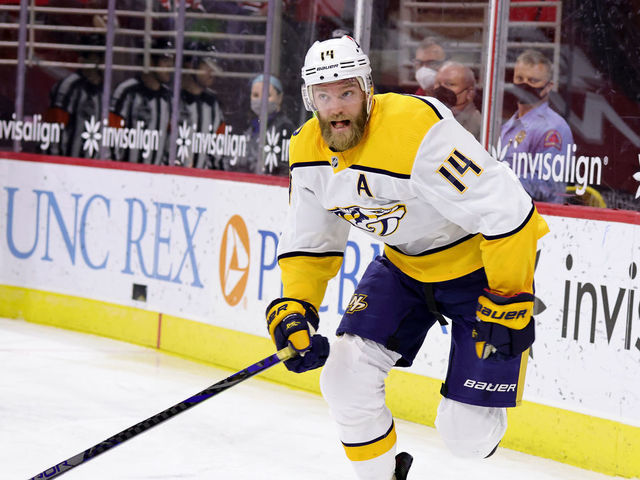 RALEIGH, NC - MARCH 9: Mattias Ekholm #14 of the Nashville Predators skates for position on the ice during an NHL game against the Carolina Hurricanes on March 9, 2021 at PNC Arena in Raleigh, North Carolina.