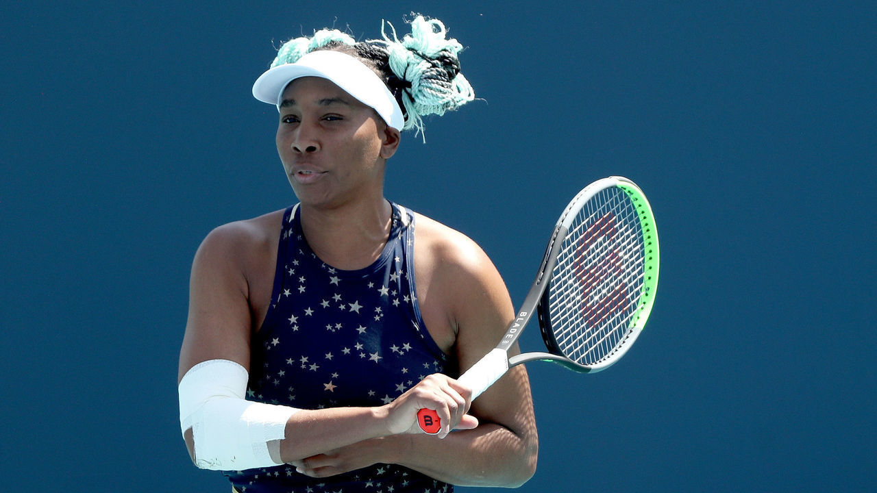 MIAMI GARDENS, FLORIDA - MARCH 23: Venus Williams returns a shot to Zarina Diyas of Kazakhstan during the Miami Open at Hard Rock Stadium on March 23, 2021 in Miami Gardens, Florida.