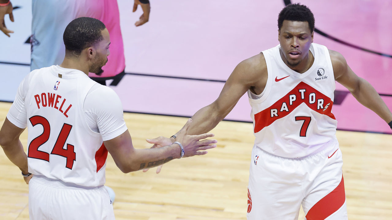 MIAMI, FLORIDA - FEBRUARY 24: Kyle Lowry #7 of the Toronto Raptors celebrates with Norman Powell #24 against the Miami Heat during the second quarter at American Airlines Arena on February 24, 2021 in Miami, Florida.