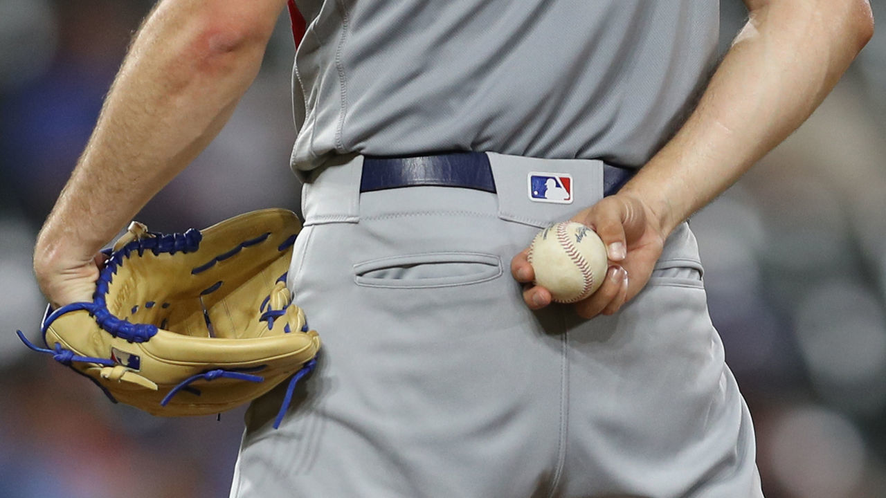 BALTIMORE, MARYLAND - SEPTEMBER 11: A detail view of a pitcher hold a ball and glove at Oriole Park at Camden Yards on September 11, 2019 in Baltimore, Maryland.