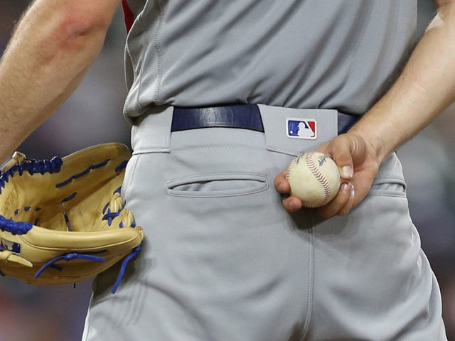 BALTIMORE, MARYLAND - SEPTEMBER 11: A detail view of a pitcher hold a ball and glove at Oriole Park at Camden Yards on September 11, 2019 in Baltimore, Maryland.