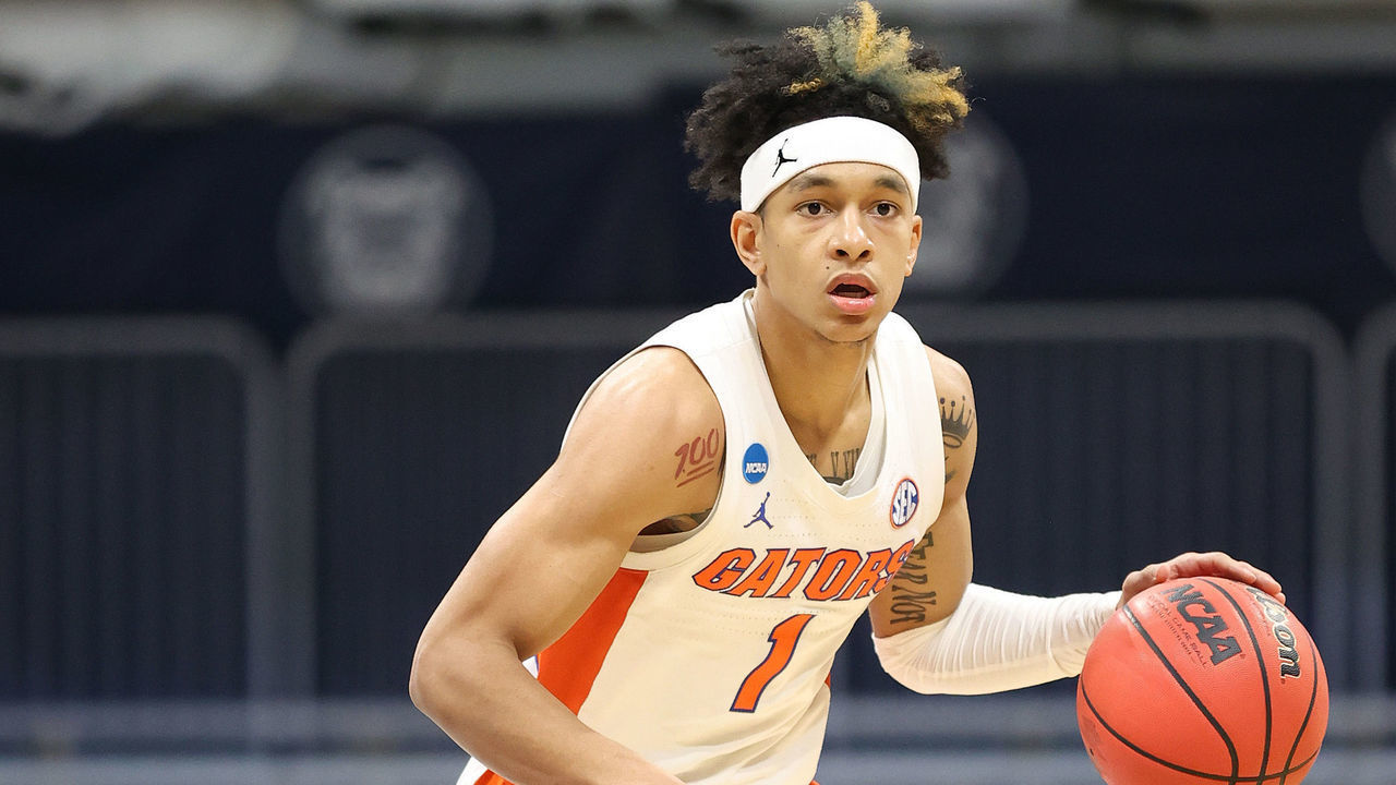 INDIANAPOLIS, INDIANA - MARCH 19: Tre Mann #1 of the Florida Gators looks to pass against the Virginia Tech Hokies in the second half in the first round game of the 2021 NCAA Men's Basketball Tournament at Hinkle Fieldhouse on March 19, 2021 in Indianapolis, Indiana.