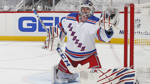 NEWARK, NJ - MARCH 04: Igor Shesterkin #31 of the New York Rangers makes a glove save during the first period against the New Jersey Devils at the Prudential Center on March 4, 2021 in Newark, New Jersey.