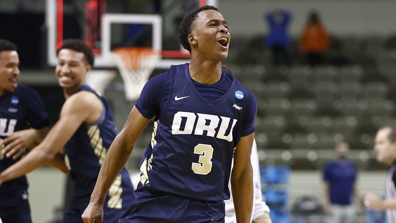 INDIANAPOLIS, INDIANA - MARCH 21: Max Abmas #3 of the Oral Roberts Golden Eagles celebrates with teammates after defeating the Florida Gators in the second round game of the 2021 NCAA Men's Basketball Tournament at Indiana Farmers Coliseum on March 21, 2021 in Indianapolis, Indiana. Oral Roberts defeated Florida 81-78.