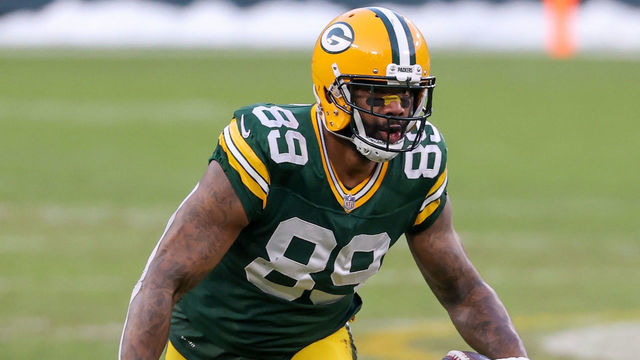 GREEN BAY, WISCONSIN - JANUARY 24: Marcedes Lewis #89 of the Green Bay Packers runs with the ball in the third quarter against the Tampa Bay Buccaneers during the NFC Championship game at Lambeau Field on January 24, 2021 in Green Bay, Wisconsin.