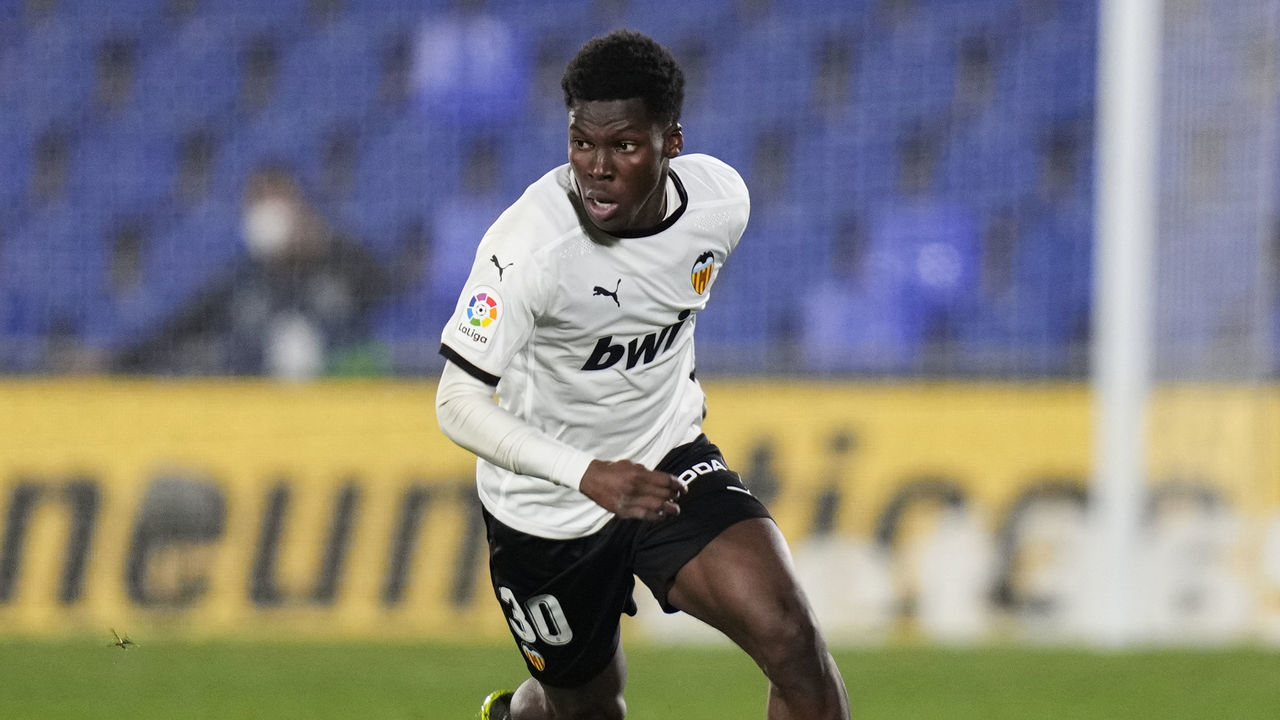 GETAFE, SPAIN - FEBRUARY 27: Yunus Musah of Valencia CF runs with the ball during the La Liga Santander match between Getafe CF and Valencia CF at Coliseum Alfonso Perez on February 27, 2021 in Getafe, Spain. Sporting stadiums around Spain remain under strict restrictions due to the Coronavirus Pandemic as Government social distancing laws prohibit fans inside venues resulting in games being played behind closed doors.