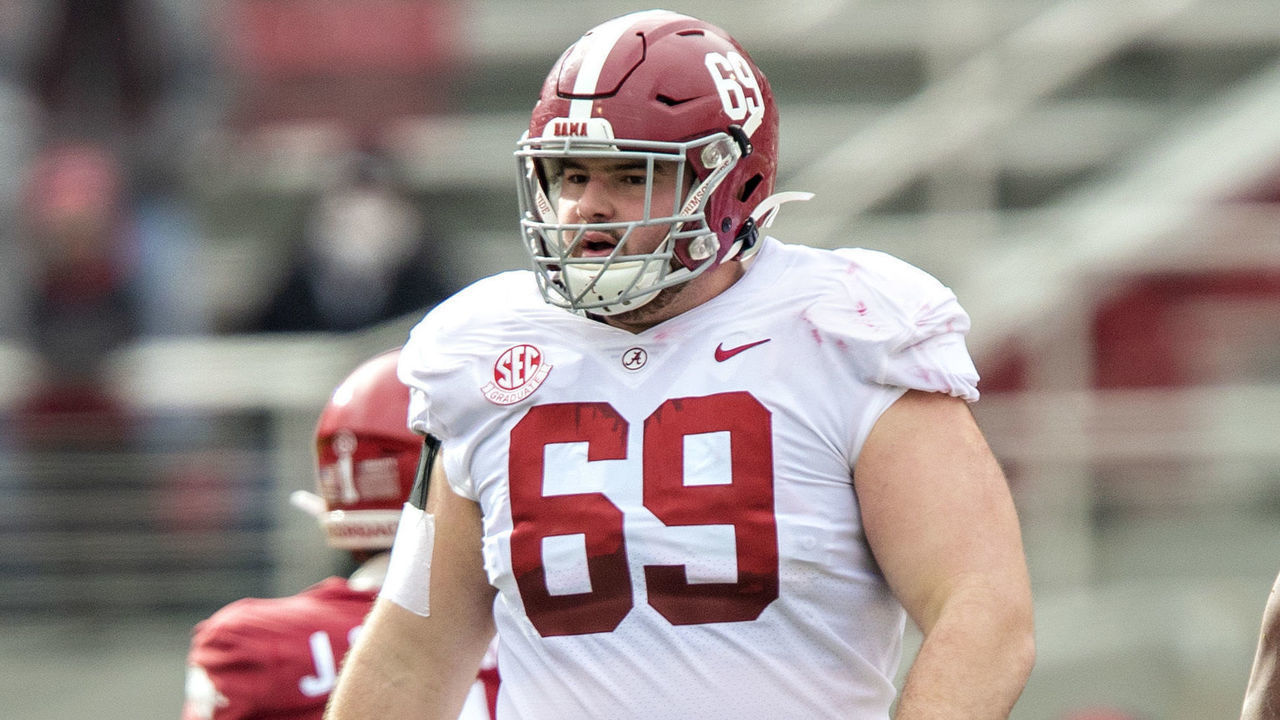 FAYETTEVILLE, AR - DECEMBER 12: Landon Dickerson #69 of the Alabama Crimson Tide at the line of scrimmage during a game against the Arkansas Razorbacks at Razorback Stadium on December 12, 2020 in Fayetteville, Arkansas. The Crimson Tide defeated the Razorbacks 52-3.