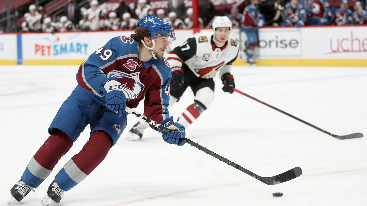 DENVER, COLORADO - MARCH 10: Samuel Girard #49 of the Colorado Avalanche advances the puck against the Arizona Coyotes in the second period at Ball Arena on March 10, 2021 in Denver, Colorado.