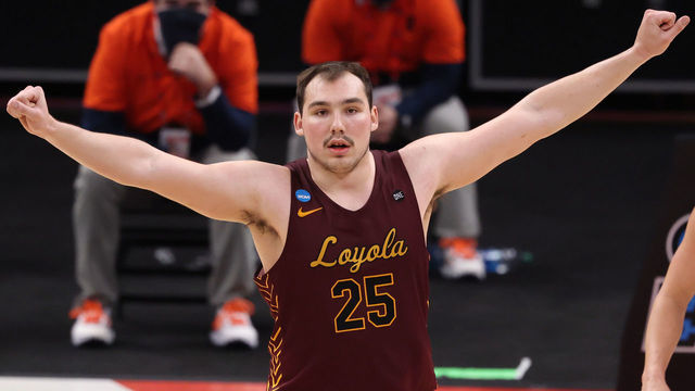 INDIANAPOLIS, IN - MARCH 21: Cameron Krutwig #25 of the Loyola Chicago Ramblers celebrates against the Illinois Fighting Illini in the second round of the 2021 NCAA Division I Men's Basketball Tournament held at Bankers Life Fieldhouse on March 21, 2021 in Indianapolis, Indiana.