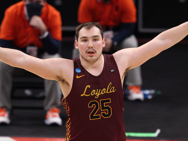 INDIANAPOLIS, IN - MARCH 21: Cameron Krutwig #25 of the Loyola Chicago Ramblers celebrates against the Illinois Fighting Illini in the second round of the 2021 NCAA Division I Men's Basketball Tournament held at Bankers Life Fieldhouse on March 21, 2021 in Indianapolis, Indiana.