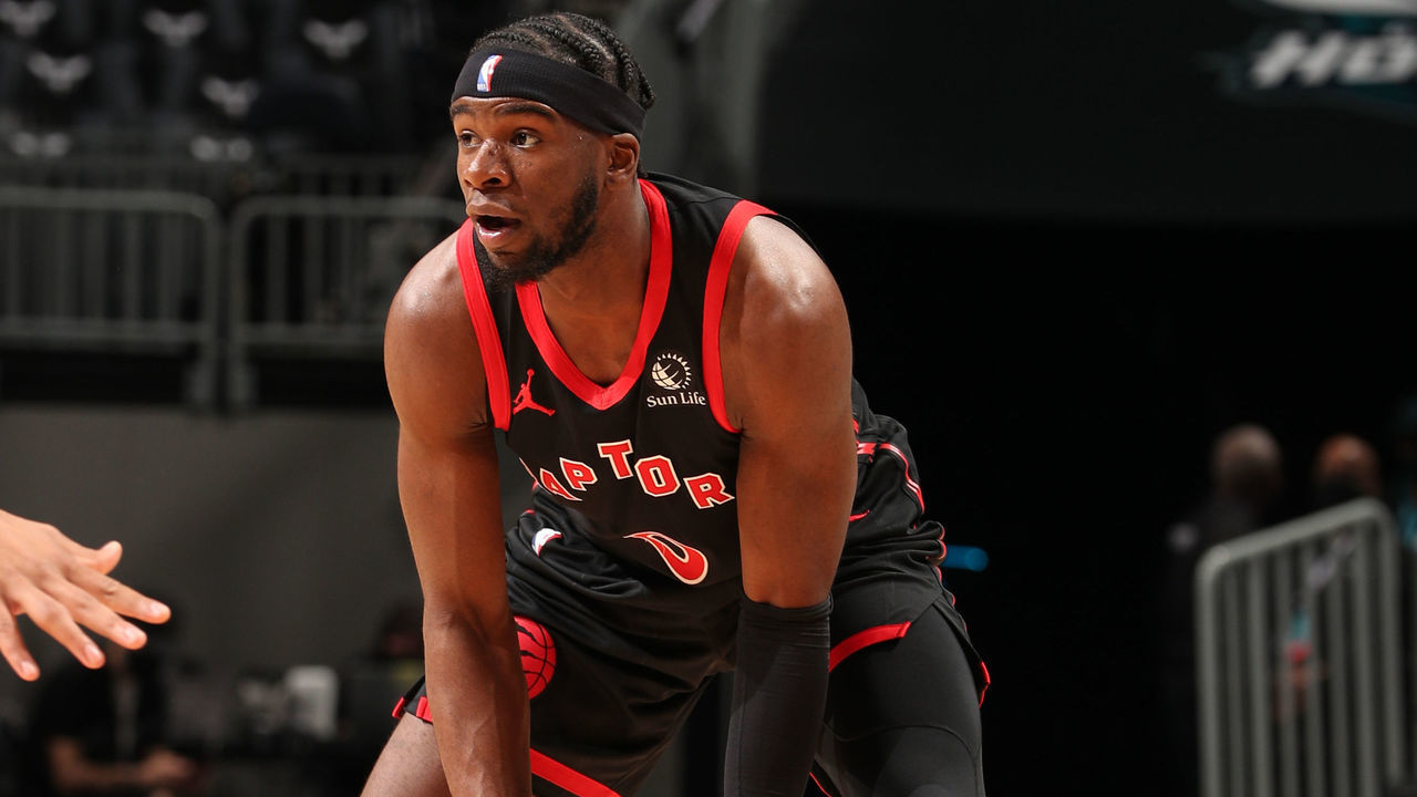 CHARLOTTE, NC - MARCH 13: Terence Davis II #0 of the Toronto Raptors handles the ball against the Charlotte Hornets on March 13, 2021 at Spectrum Center in Charlotte, North Carolina. Mandatory Copyright Notice: Copyright 2021 NBAE