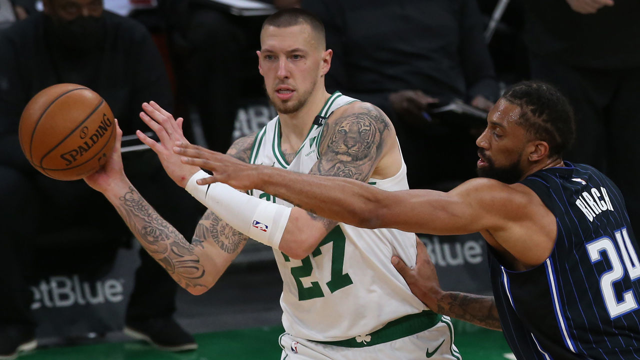 BOSTON MA. MARCH 21: Boston Celtics center Daniel Theis gets off a pass in front of Orlando Magic center Khem Birch during the 2nd quarter of the game at the TD Garden on March 21, 2021 in Boston, MA. (Staff Photo By Nancy Lane/MediaNews Group/Boston Herald)