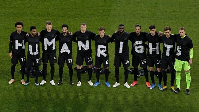Germany's players pose for a group photo with the wording "Human rights" on their T-shirts prior to the FIFA World Cup Qatar 2022 qualification football match Germany v Iceland in Duisburg, western Germany on March 25, 2021.